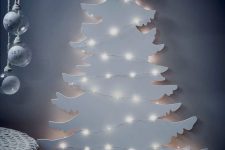 23 a white plywood Christmas tree with lights is a beautiful and very cool idea for a modern space, it won’t take much space