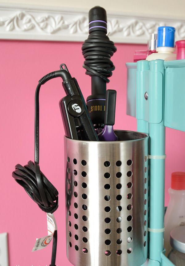 an IKEA utensil holder used for storing a curling iron and straightener - great to store your hot tools in it