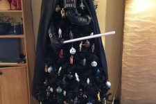 25 a unique black Darth Vader Christmas tree with ornaments themed as Star Wars is a lovely and bold idea to rock