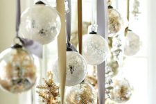 25 glam Christmas decor with gold fir branches, white and gold Christmas ornaments can be attached over the table
