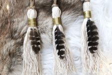 26 tassel ornaments with feathers and gold rings plus twine are lovely boho Christmas ornaments that you can make yourself