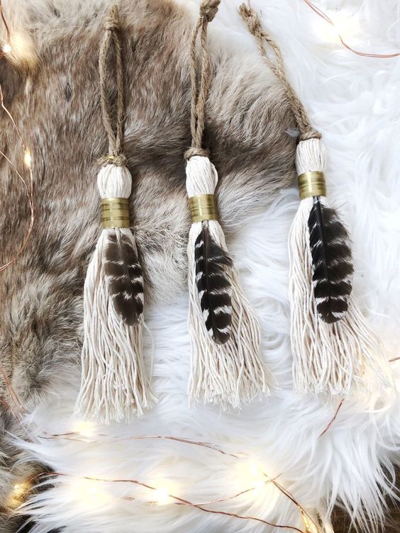 tassel ornaments with feathers and gold rings plus twine are lovely boho Christmas ornaments that you can make yourself