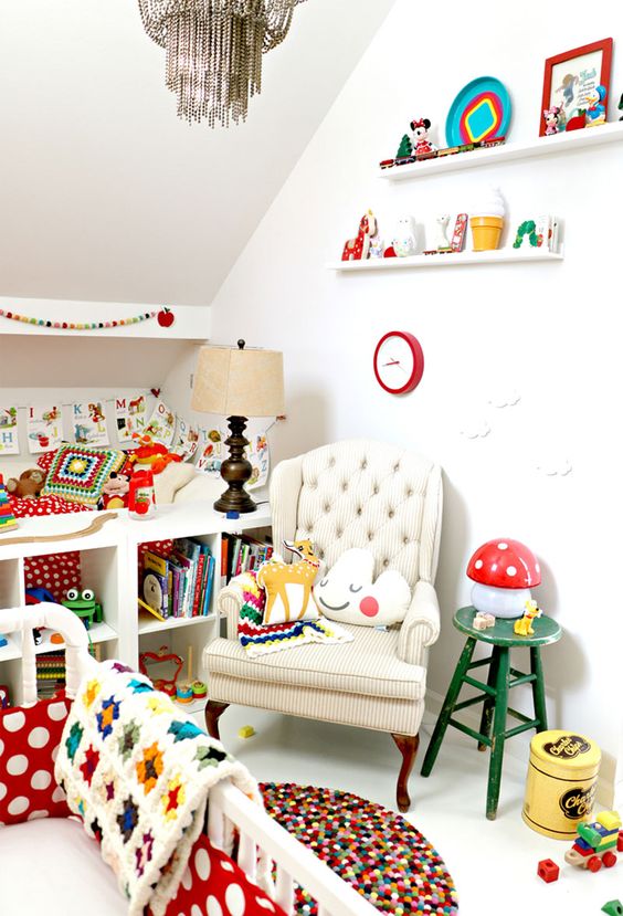 a colorful retro Scandinavian nursery with bold printed bedding, rugs, toys, books and accessories is a bold and fun palce to be