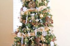 a fabulous rustic Christmas tree with burlap ribbons, vine balls, pinecones, snowflakes, lights and some stars