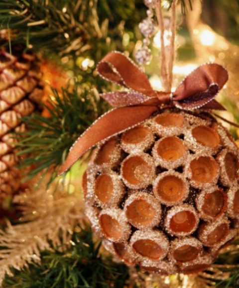 a glitter acorn Christmas ornament with a matching bow looks bold and frozen and is amazing