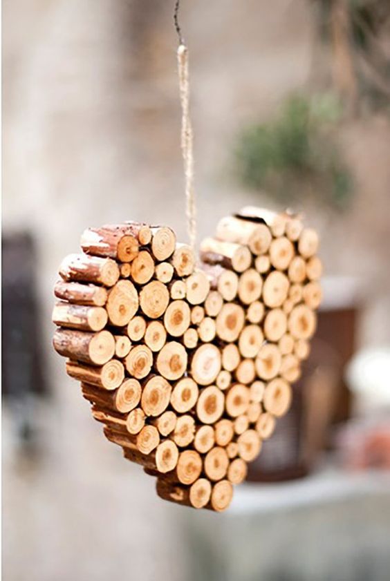 a heart Christmas ornament of wood sticks is a lovely idea for adding a slight rustic feel to the space