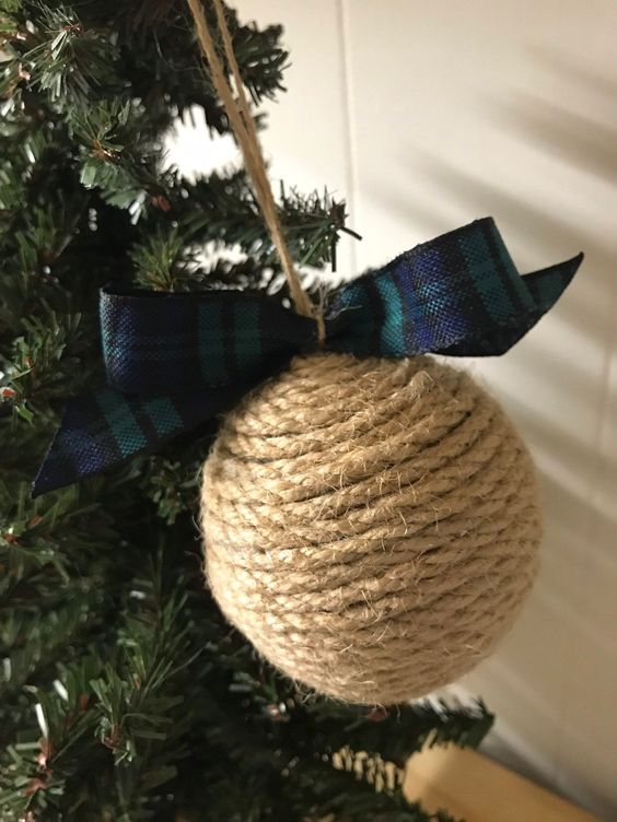 a rustic twine Christmas ornament with a plaid bow is a gorgeous idea and you can make it yourself anytime