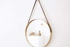 a suspended mirror made of a usual one using an IKEA tray and some leather cord is an easy idea