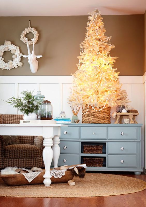 a white tabletop Christmas tree decorated with only lights and beads is a cool idea for a farmhouse space
