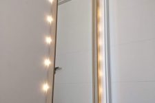 an IKEA Nissedal mirror hacked with lights will be ideal for your entryway or for your vanity nook