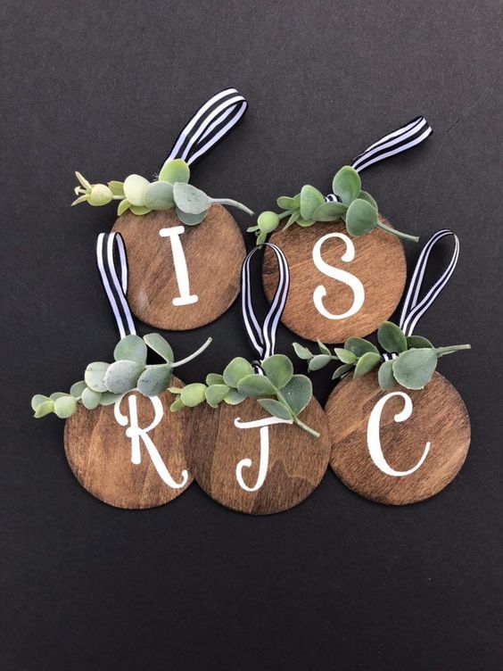 cute rustic Christmas ornaments of plywood circles, greenery and striped loops are perfect for home decor