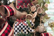 plaid and burlap bear ornaments with plaid bows and evergreens plus lots of plaid and burlap ribbons around