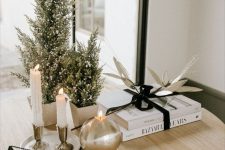 small tabletop Christmas trees with some snow on them are perfect for a modern or Scandinavian space