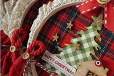 super pretty embroidery hoop Christmas ornaments with plaid, glitter stars, signs, twine, bells and wood burnt mini houses