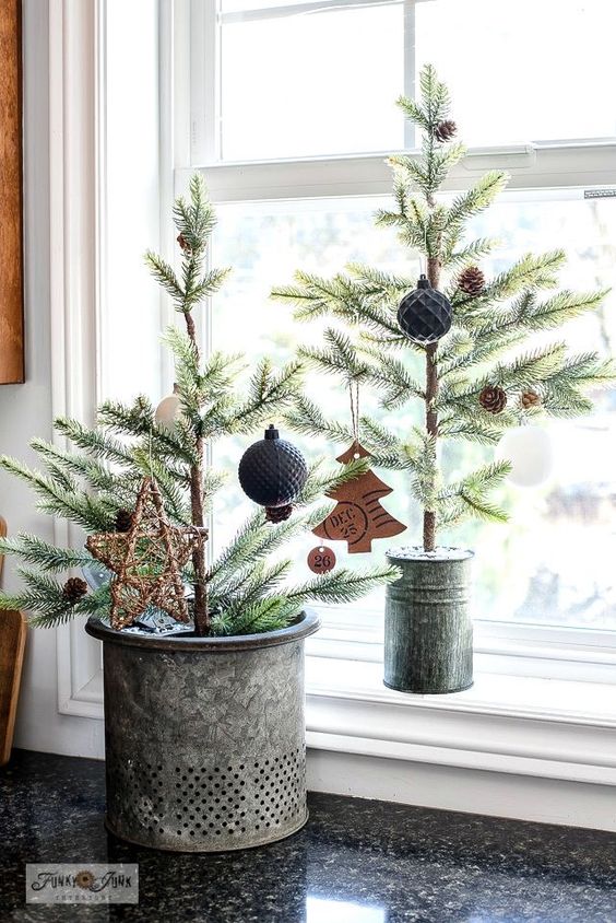 tabletop Christmas trees with pinecones, black and white ornaments and som paper ones are great