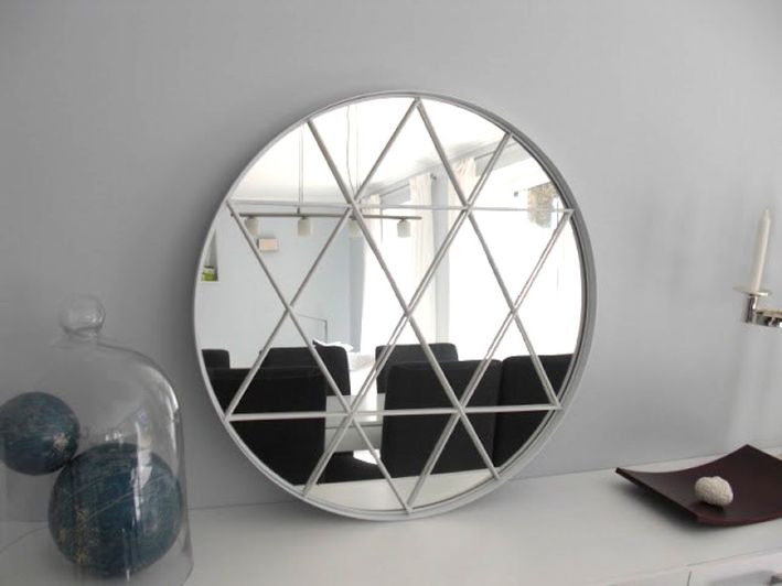 this round mirror looks refined and chic but was hacked for a couple of bucks
