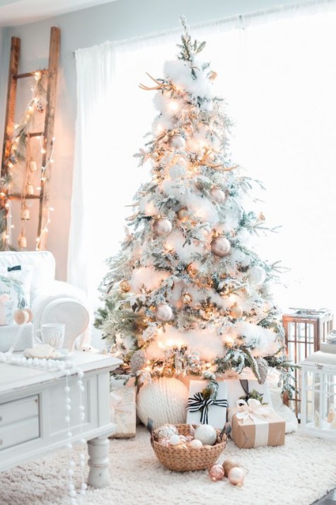 lovely almost all-white flocked christmas tree decor with shiny details