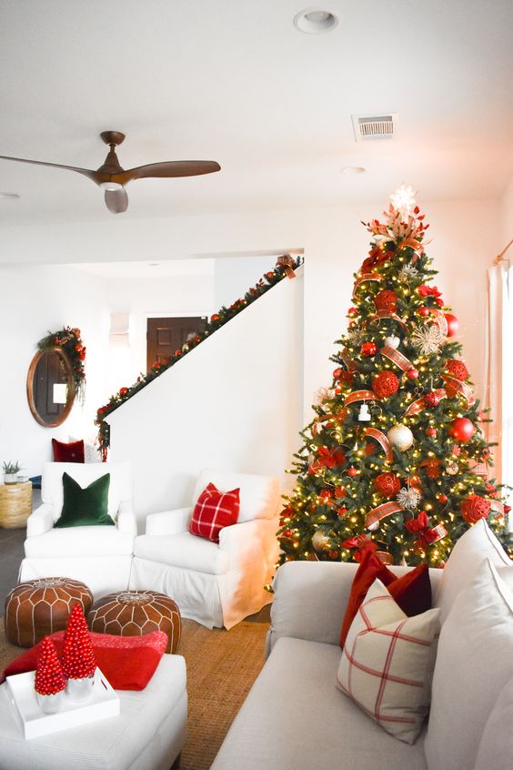 a glam christmas tree in an almost white room