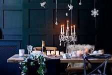 16 a lovely Christmas tablescape with a refined candelabra and a fresh greenery installation with elegant white ornaments