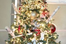 17 a bright rustic Christmas tree with lights, branches, plaid and polka dot ornaments and metallic ones, too plus a plaid cover