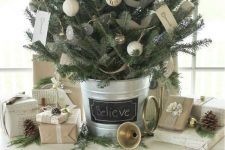 18 a farmhouse Christmas tree with chalkboard, yarn and burlap ornaments and in a bucket with a chalkboard tag on it is very cozy and chic
