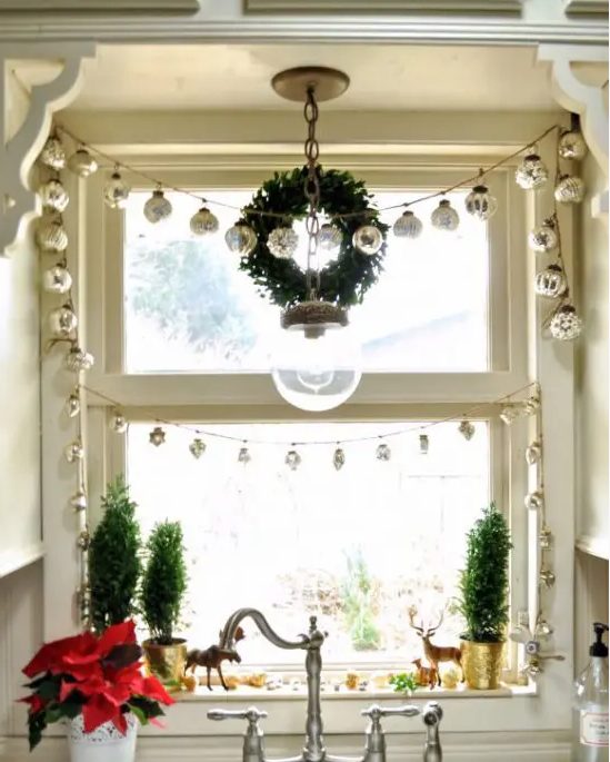 a Christmas garland composed of mercury glass Christmas ornaments is a lovely and cool decoration and you may apply it anywhere
