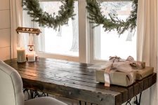 a branch with fir wreaths on burlap ribbons perfectly complete this vintage rustic space decor, they are easy to make
