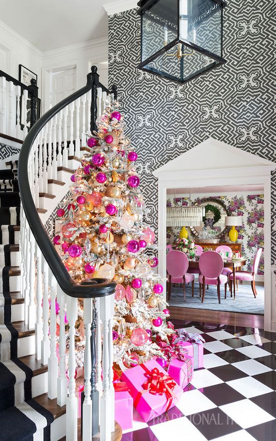 a bright and fun glam Christmas tree   a flocked one decorated with gold, pink, blush ornaments and lights plus hot pink gift boxes