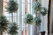 a bunch of faux tabletop evergreens in different sizes would make a perfect windowsill’s display