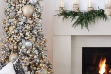 a glam Christmas tree – a flocked piece withan immense amount of silver and gold ornaments and lights will bring a shiny touch to the space