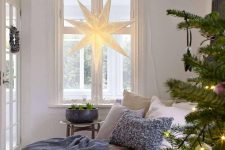 a large star pendant lamp is a cool and creative decoration for Christmas, it looks pretty and lovely