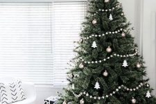 a lovely and simple Christmas tree with a bead garland, white and metallic ornaments is a cool idea to rock
