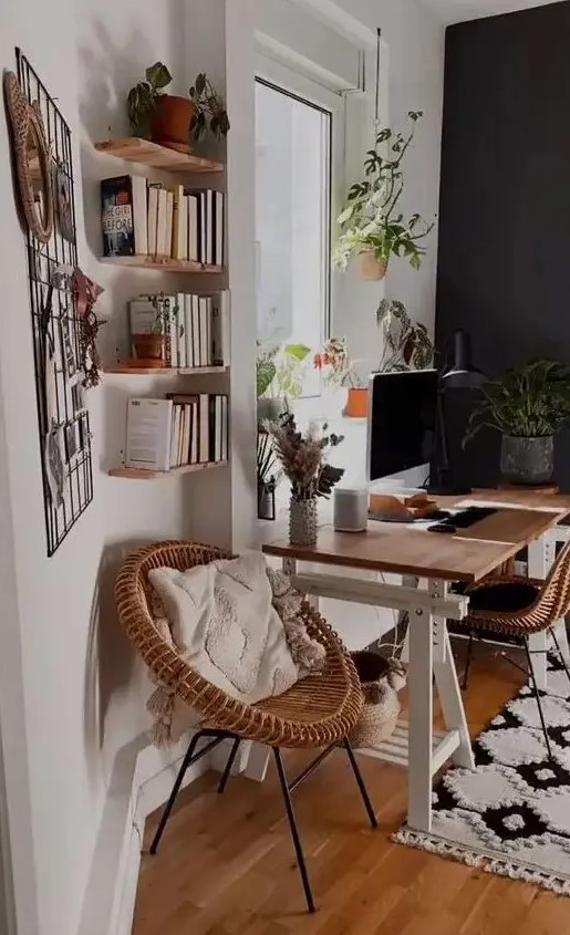 a modern country home office with a trestle desk, rattan chairs, floating shelves, a memo grd and some cool potted plants