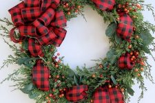 modern christmas wreath with plaid ornaments and ribbons