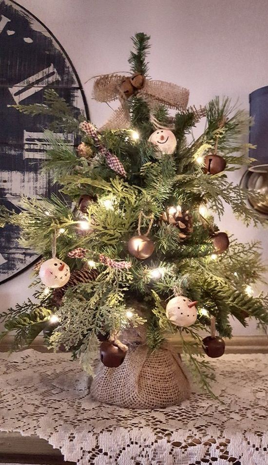 a rustic looking tabletop christmas tree with lights