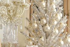 a refined vintage silver Christmas tree with pearly ornaments and lights is a very chic and very beautiful option to rock