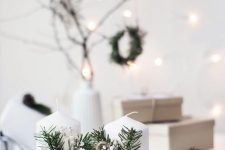 a wooden board, white candles, baby’s breath, fir branches for lovely and chic Nordic Christmas decor
