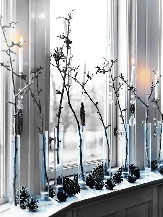 Branches in tube vases and pinecones will give an all natural and relaxed feel to the space