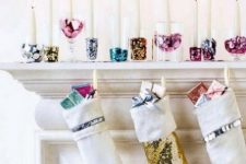 colorful sequin and glitter candle holders and stockings with sequins and mini gifts will help you create a glam feel in the space