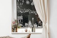 fun and pretty Christmas window decor with snow, snowflakes, ornaments and houses plus a snowman is awesome