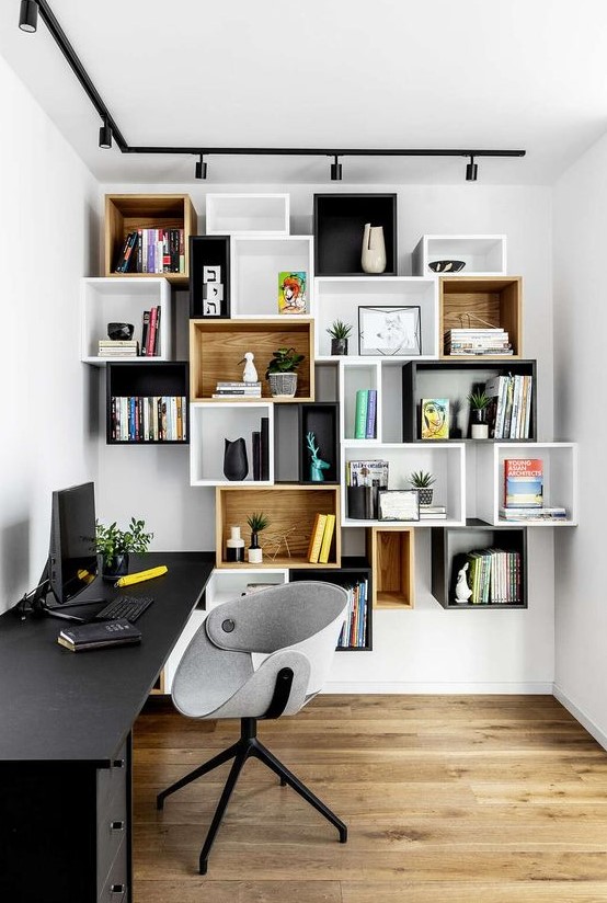 mismatching box wall-mounted shelving units double as decoration in a home office