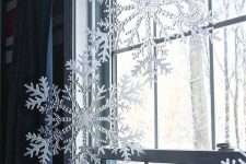 oversized clear and shiny snowflakes will give your window a frozen look, and your space a winter wonderland touch