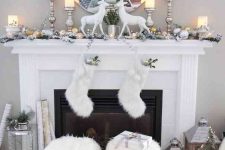 silver and gold ornaments, silver candleholders with candles, beads, fur stockings, oversized lanterns, silver ornaments and fir stools