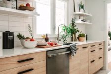 a Scandi galley kitchen with MDF cabinets, white stone countertops, white skinny tiles, open shelves and a pendant lamp