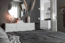 a cozy bedroom with black walls