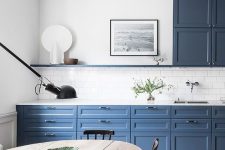 a cute blue and white kitchen design