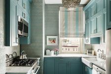 a beautiful turquoise kitchen with white countertops, a window instead of a backsplash and vintage faucets