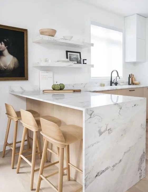 a contemporary blonde wood kitchen with white stone countertops and matching open shelves is a very fresh idea