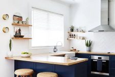 a navy and white kitchen design