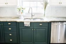 a one wall two tone kitchen in white and dark green, with stone countertops and a patterned tile backsplash